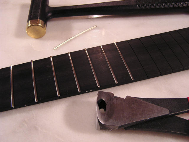 Hammering, leveling, and dressing the frets